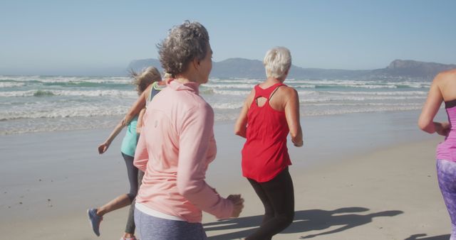 Diverse women wearing sports clothes running together at beach - Download Free Stock Photos Pikwizard.com