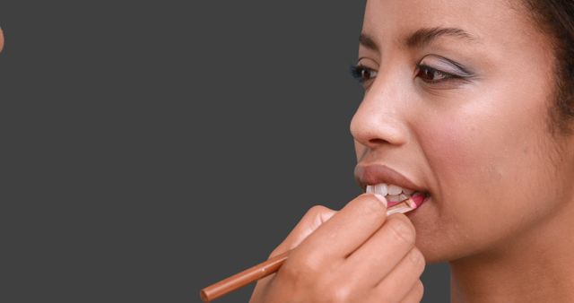 Woman Having Makeup Applied Focusing on Lip Liner - Download Free Stock Images Pikwizard.com