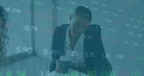 African american businesswoman with stock market data overlay