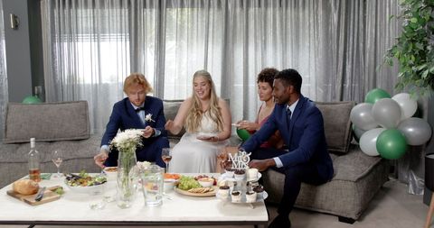Bride and Groom Toasting with Friends at Casual Wedding Reception