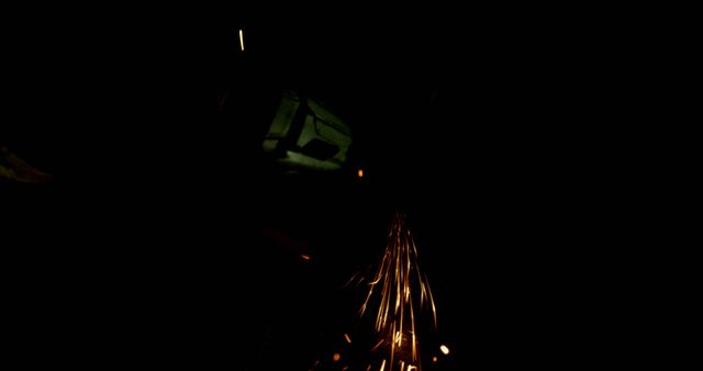 Worker Using Grinder Producing Sparks in Dark Environment - Download Free Stock Images Pikwizard.com