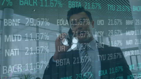 A businessman talking on a smartphone with a transparent overlay of stock market data represents modern business communication interlinked with financial technology. Ideal for use in media regarding global finance updates, economic trend predictions, and technological advancements in data analysis.