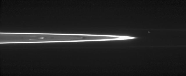 Tiny, dust-sized particles in Saturn rings become much easier to see at high phase angle -- the angle formed by the Sun, the rings and the spacecraft. The brightest ring is the F ring; the next feature to the left is the outer edge of the A ring