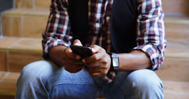 Man Texting on Smartphone While Sitting on Steps - Download Free Stock Images Pikwizard.com