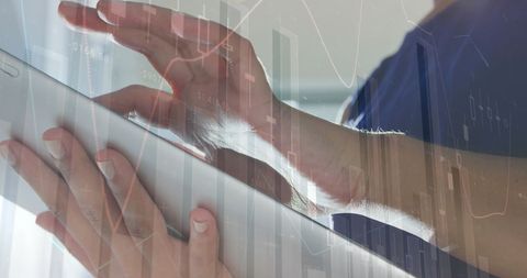 Businesswoman Analyzing Data on Digital Tablet in Office