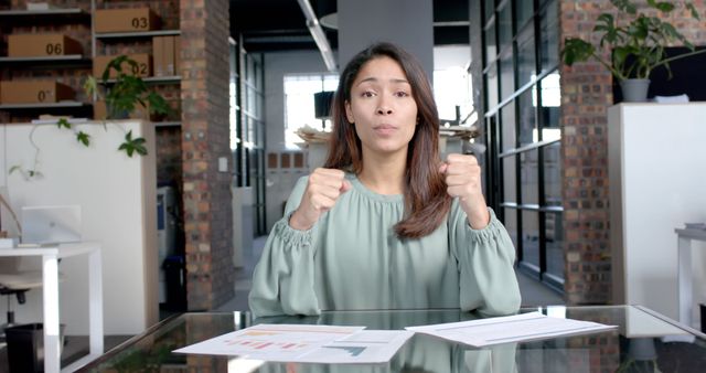 Focused Businesswoman Engaging in Video Conference at Office Desk - Download Free Stock Images Pikwizard.com