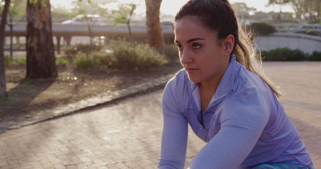 Determined Female Athlete Stretching Outdoors at Sunrise - Download Free Stock Images Pikwizard.com