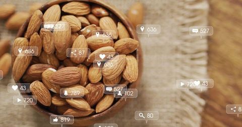 Almonds in Wooden Bowl with Social Media Interaction Overlay