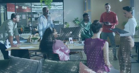 Diverse Team Collaborating on Data Strategies in Modern Office