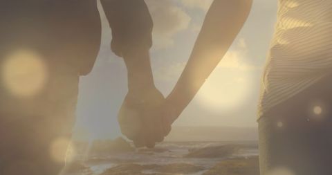 Couple Holding Hands in Golden Sunset Glow - Download Free Stock Images Pikwizard.com