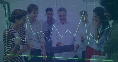 Multicultural team analyzing business data on laptop with glowing analytics overlay