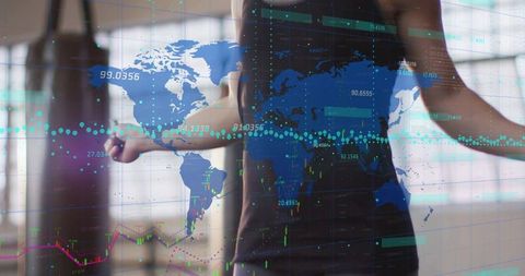 Woman exercising with battle ropes, interacting with global data overlay and financial charts