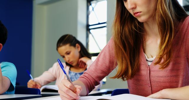 Focused Students Taking Notes in Classroom - Download Free Stock Images Pikwizard.com