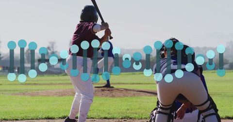 Female softball player swinging bat on sunny field