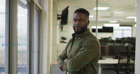 Confident Professional in Open-Plan Modern Office Setting