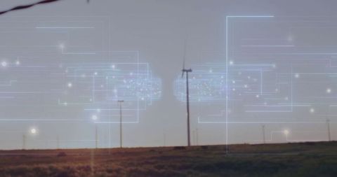 Wind turbines spinning with digital circuit overlay