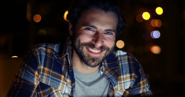 Smiling Man With Beard in Plaid Shirt at Night - Download Free Stock Images Pikwizard.com
