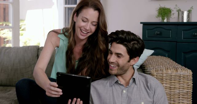 Happy Couple Enjoying Digital Content on Tablet at Home - Download Free Stock Images Pikwizard.com
