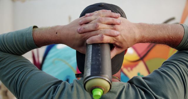 Graffiti Artist Observing Colorful Mural with Spray Paint Can - Download Free Stock Images Pikwizard.com