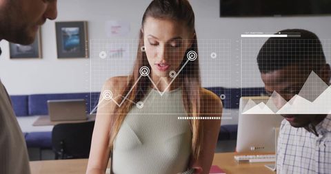 Diverse team collaborating on data analytics with digital interface