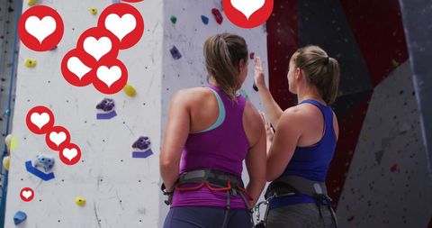 Two Fit Women at Climbing Gym with Social Media Hearts Overlay
