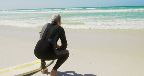 Senior Surfer Watching Ocean Waves with Surfboard on Beach - Download Free Stock Images Pikwizard.com