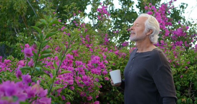 Caucasian Man Savoring Morning Coffee in Lush Garden - Download Free Stock Images Pikwizard.com