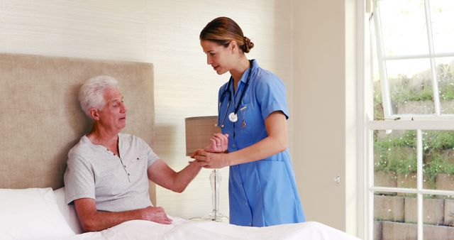 Nurse caring for elderly patient in bedroom - Download Free Stock Images Pikwizard.com