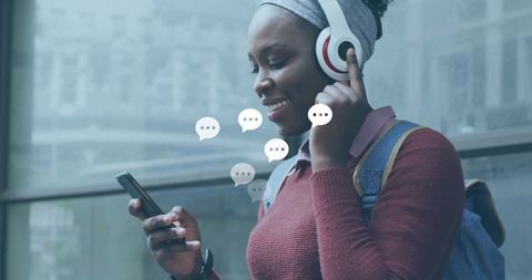 Woman Enjoying Music on Headphones While Waiting for Transportation