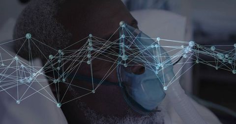 Mature patient wearing oxygen mask with network overlay showing respiratory monitoring