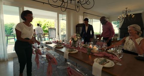 Preparing Elegant Dining Table for Wedding Celebration