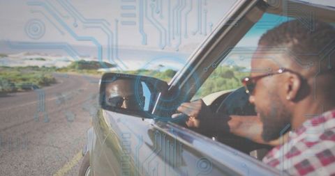 Leaning driver checking side mirror on coastal road with digital circuit overlay