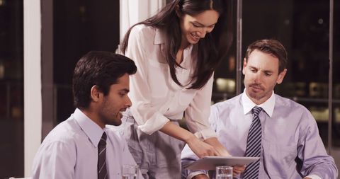 Team Collaboration with Digital Tablet in Office Meeting