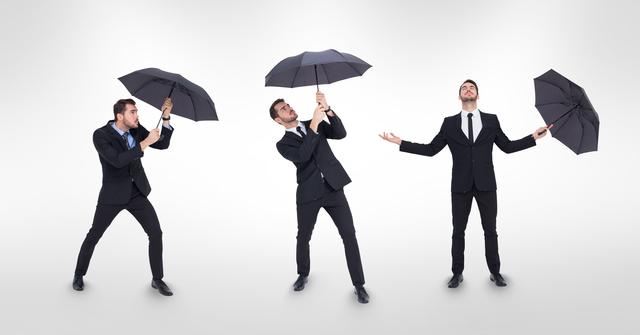 Three businessmen in formal suits holding umbrellas in different poses. They display a variety of expressive gestures, suggesting themes of protection, preparedness, and reaction to changing circumstances. Ideal for corporate training material, presentations on dealing with challenges in business, and advertising for insurance or weather-related services.