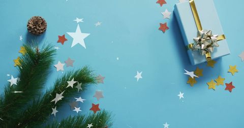 Festive Christmas Scene with Gift and Star Confetti