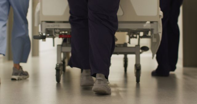 Medical Staff Pushing Hospital Bed through Corridor - Download Free Stock Images Pikwizard.com