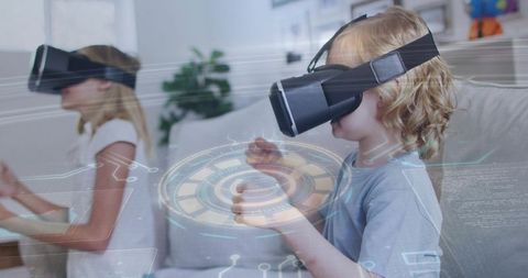 Children wearing vr headsets playing with futuristic holographic interface on couch
