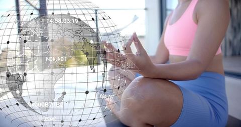 Fit woman sitting practicing meditation and yoga holding mudra with ar global network overlay