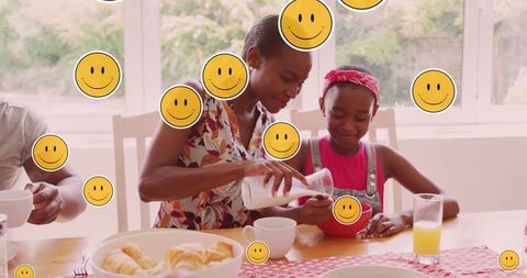 Mother and Daughter Bonding Over Breakfast with Smileys