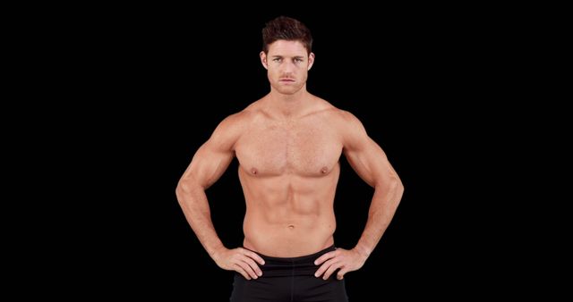 Focused Muscular Man Showcasing Athletic Physique Against Black Background - Download Free Stock Images Pikwizard.com