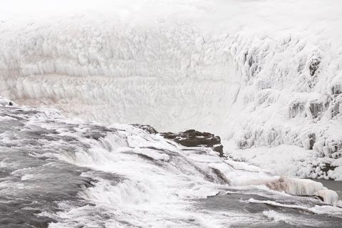 Majestic frozen waterfall in remote snowy landscape