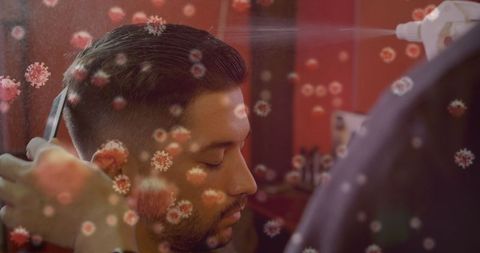 Haircut with hygiene measures under virus particle overlay