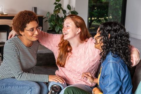 Diverse Female Friends Sharing Companionship in Cozy Living Room
