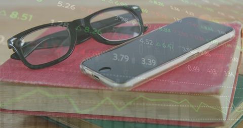 Stock Market Data Overlaying Books, Smartphone, and Glasses - Download Free Stock Images Pikwizard.com
