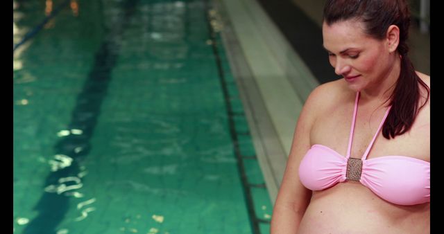 Pregnant Woman in Pink Swimsuit at Indoor Pool - Download Free Stock Images Pikwizard.com