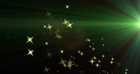 Glowing golden stars and light trails on dark background