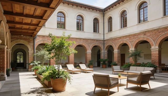 Sunlit mediterranean cloister courtyard with woven seating and terracotta planters