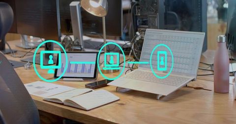 Office workspace with laptop displaying business analytics