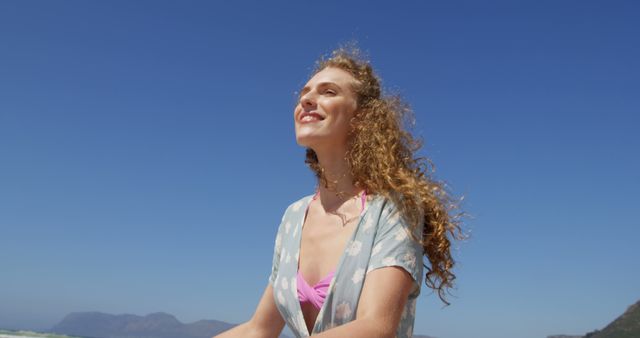 Joyful Young Woman Enjoying Sunny Day at Beach - Download Free Stock Images Pikwizard.com