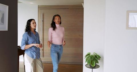 Diverse Friends Discussing Home Interiors with Modern Decor